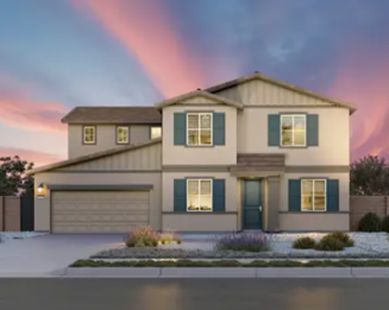 A modern two-story house with blue shutters, landscaped foreground, and a colorful sunset sky.